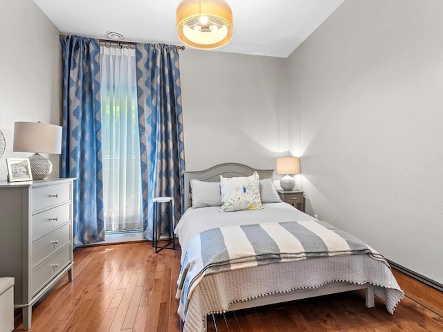 bedroom featuring wood-type flooring