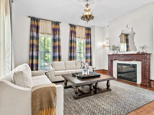 living room with a fireplace, hardwood / wood-style floors, and a wealth of natural light