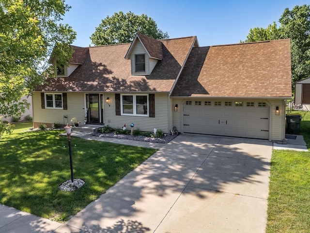 new england style home with a front yard and a garage