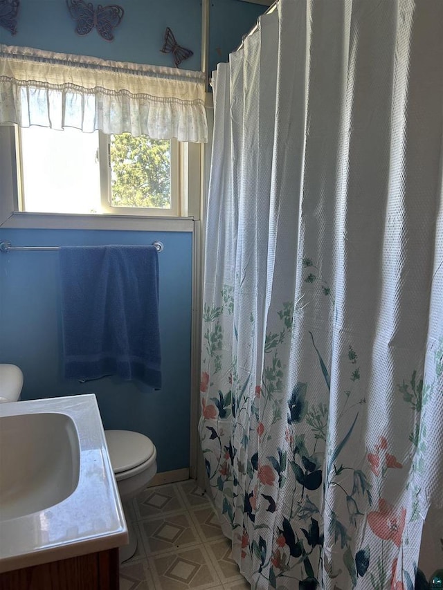 157 E 2nd St, Glidden, WI 54527 - bathroom featuring a shower with curtain, vanity, and toilet