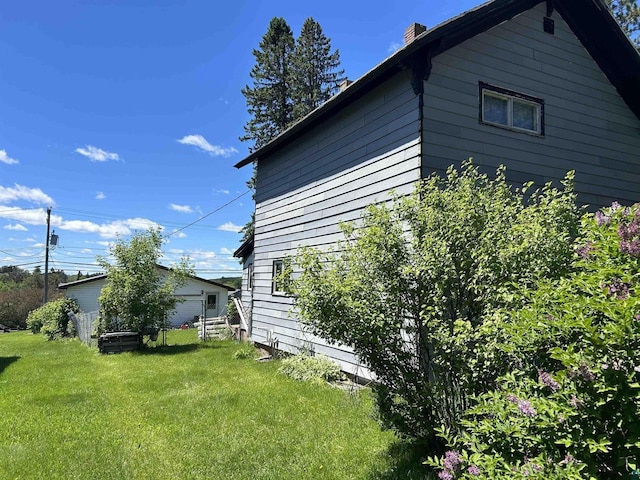 157 E 2nd St, Glidden, WI 54527 - view of side of home with a lawn