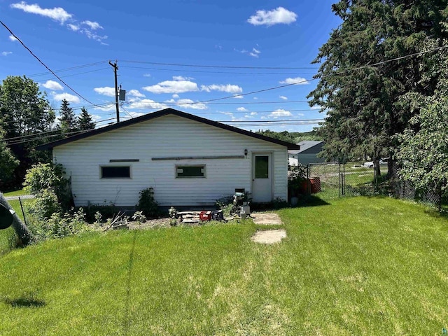 157 E 2nd St, Glidden, WI 54527 - rear view of property featuring a lawn