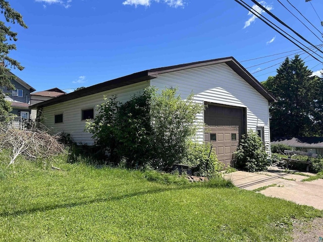 157 E 2nd St, Glidden, WI 54527 - view of front of home with a garage, a front lawn, and an outdoor structure