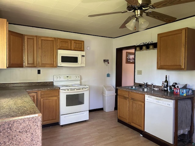 157 E 2nd St, Glidden, WI 54527 - kitchen with light wood-type flooring, white appliances, ceiling fan, and sink