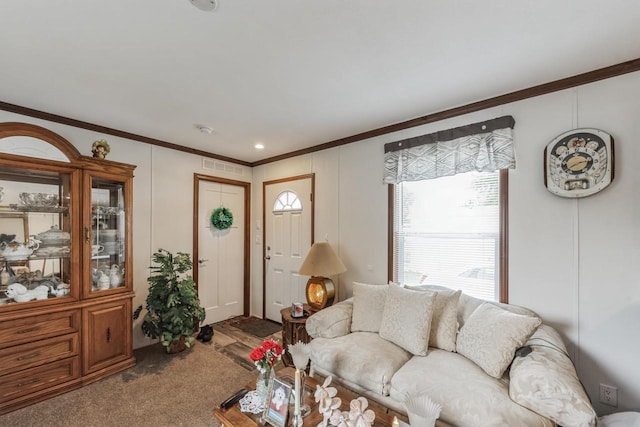 carpeted living room featuring ornamental molding