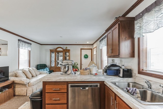 kitchen with stainless steel dishwasher, ornamental molding, sink, and light carpet