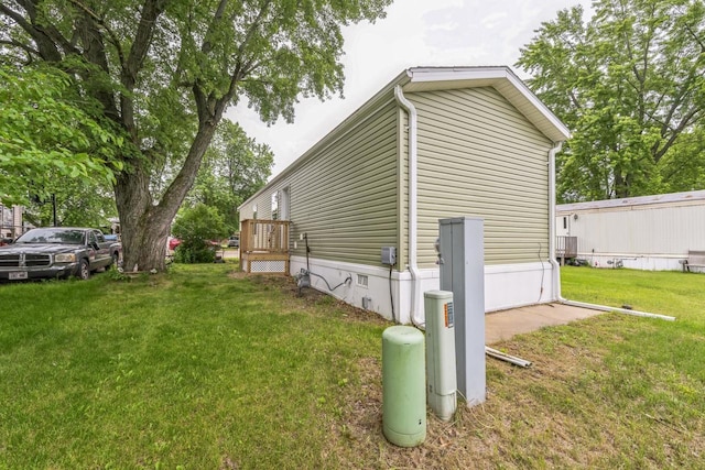 view of property exterior featuring a lawn