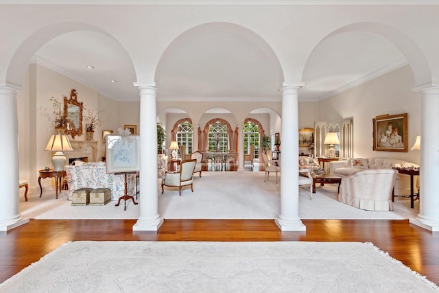 interior space featuring wood-type flooring and ornamental molding