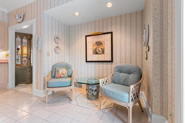 living area with light tile patterned flooring and ornamental molding