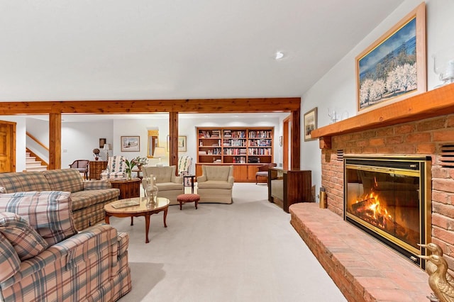 carpeted living room with a brick fireplace