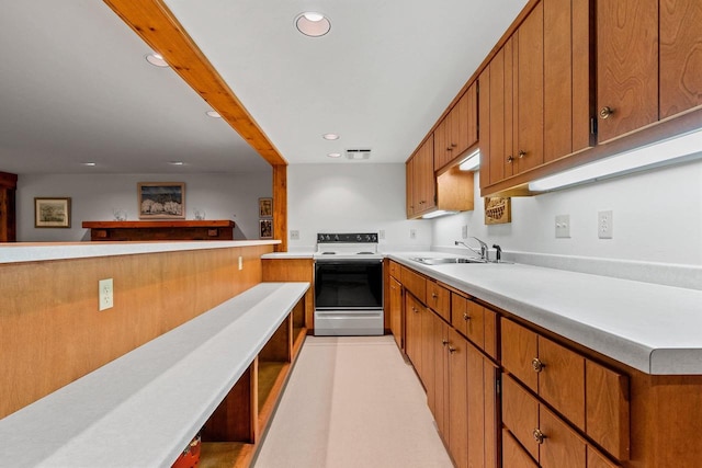 kitchen featuring sink and electric range oven