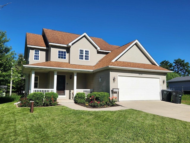 view of front of house with a front lawn, a porch, and a garage