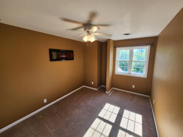 empty room with carpet and ceiling fan