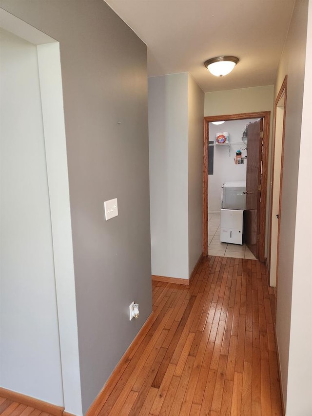 corridor with light wood-type flooring