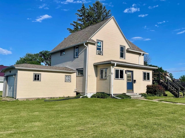 rear view of property featuring a yard