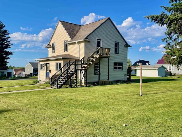 rear view of house with a yard