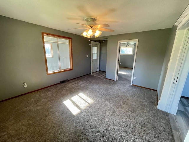 unfurnished bedroom with ceiling fan, a closet, and carpet floors