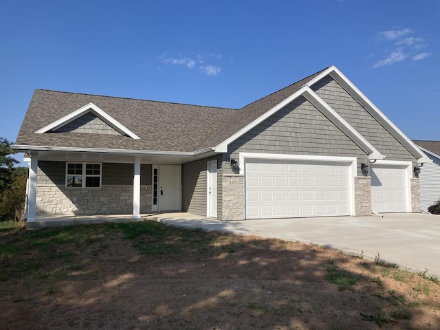 view of front of house with a porch and a garage