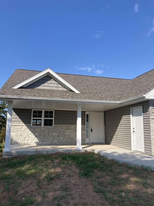 ranch-style home with covered porch