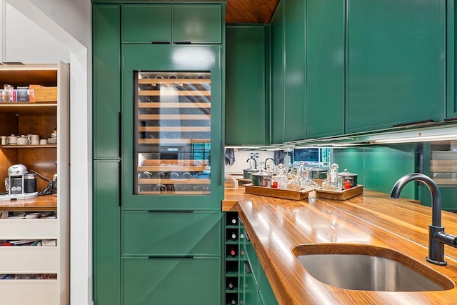 kitchen featuring sink and green cabinets