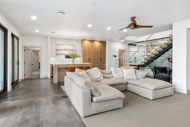 living room featuring ceiling fan