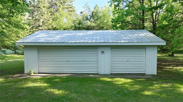 garage featuring a lawn