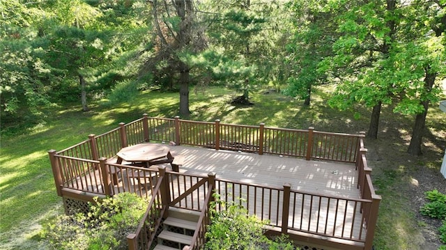 wooden deck with a lawn