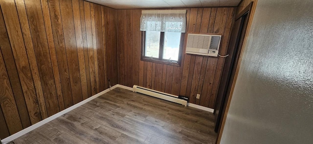 N9451 Parkway Rd, Crivitz, WI 54114 - spare room with baseboard heating, wood walls, a wall mounted air conditioner, and dark wood finished floors