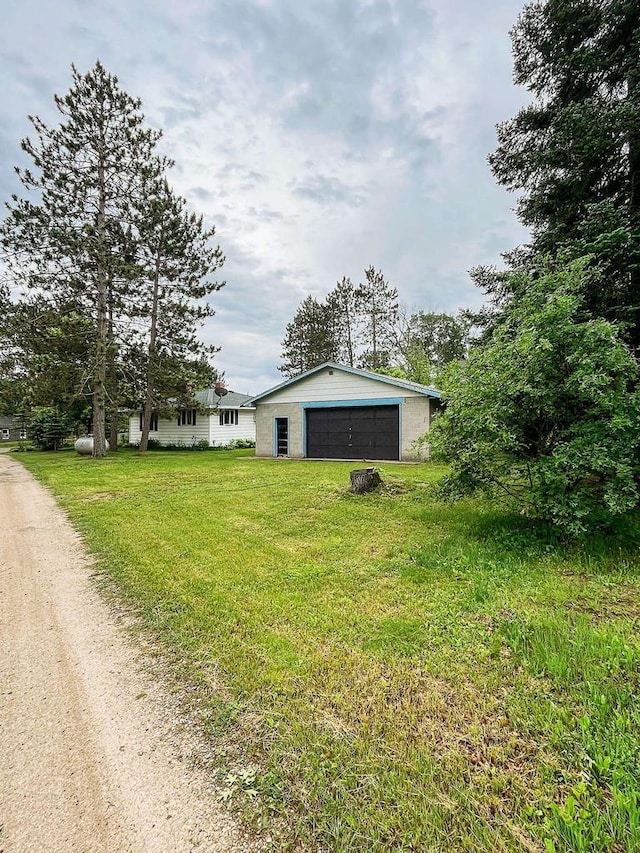 N9451 Parkway Rd, Crivitz, WI 54114 - view of front of house featuring a detached garage, an outdoor structure, and a front yard