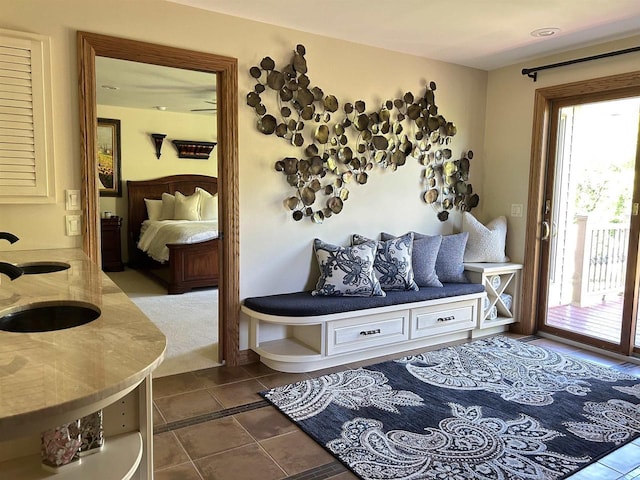 interior space with dark tile patterned floors and sink