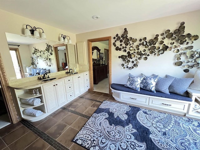 bathroom with tile patterned flooring and vanity