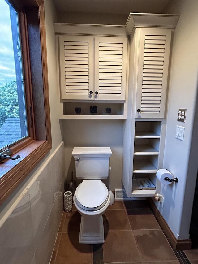 bathroom featuring tile patterned floors and toilet