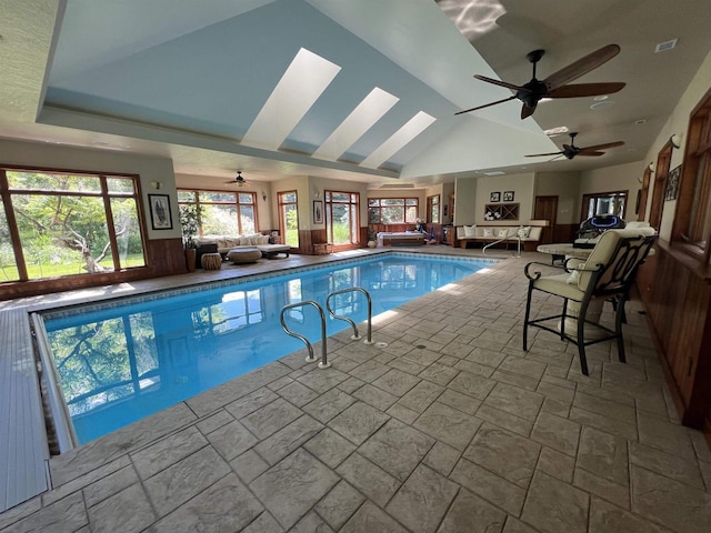 view of pool with ceiling fan and a skylight