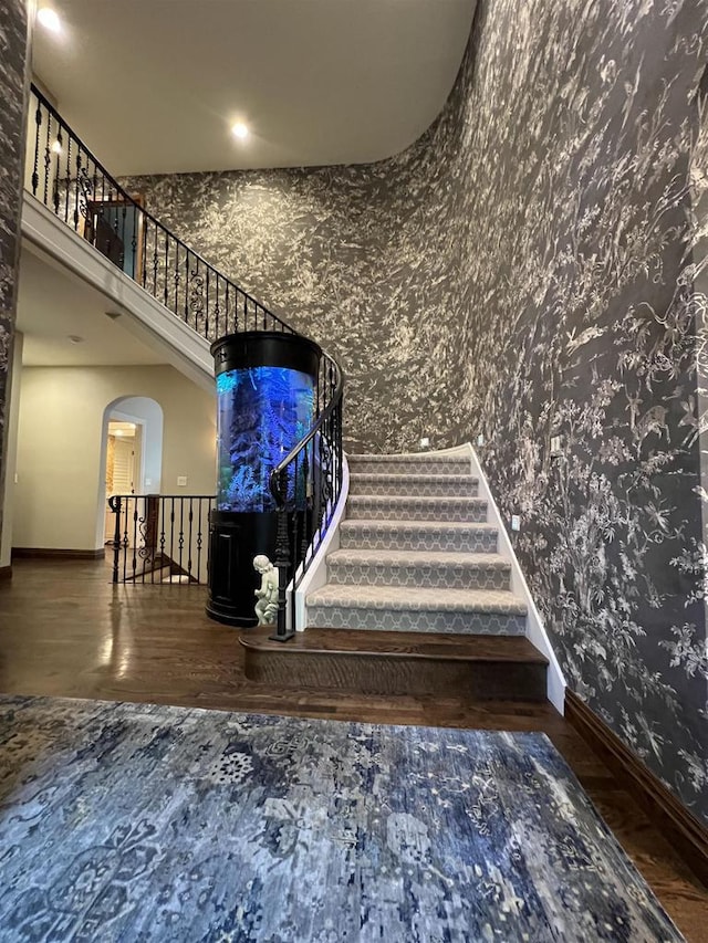 stairway featuring hardwood / wood-style floors