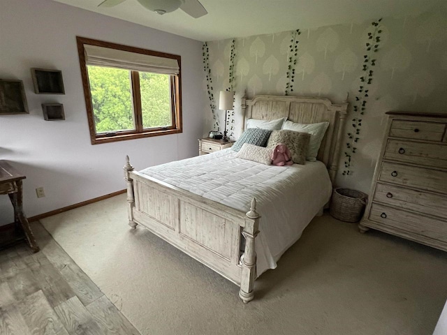 bedroom featuring light wood-type flooring and ceiling fan