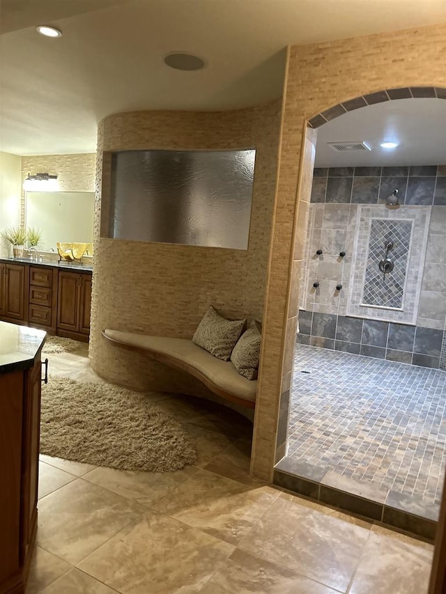 bathroom featuring vanity and walk in shower