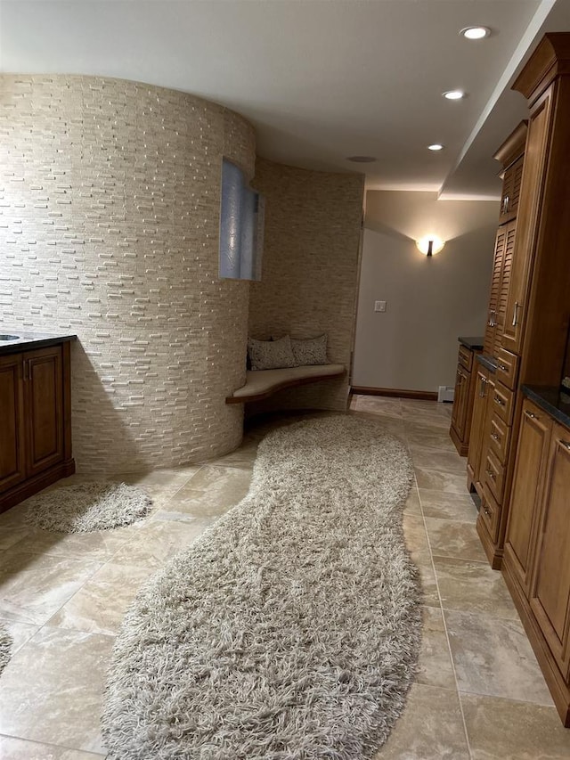 hallway with a baseboard heating unit