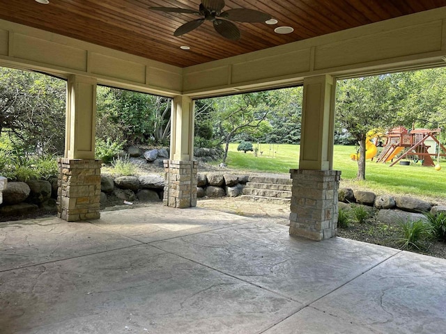 view of patio featuring a playground and ceiling fan