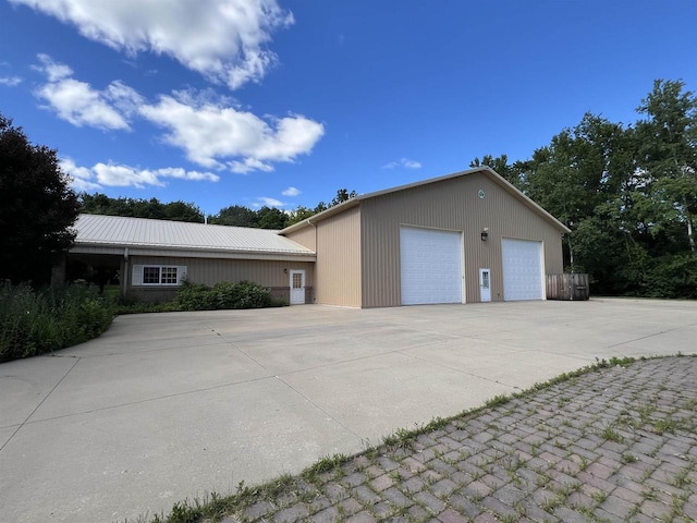 exterior space with an outdoor structure and a garage