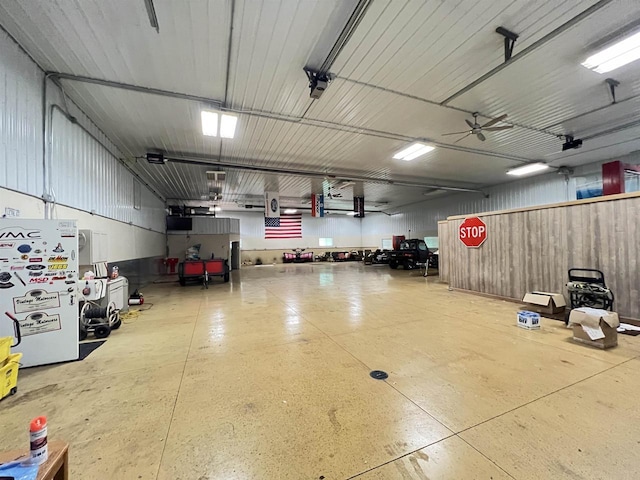 garage featuring a garage door opener and ceiling fan