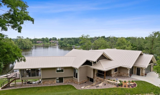 view of front of property with a water view and a front yard