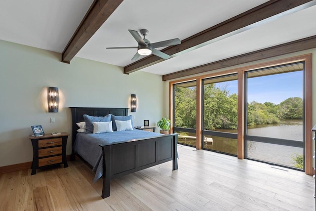 bedroom featuring ceiling fan, beam ceiling, light wood-type flooring, and access to outside