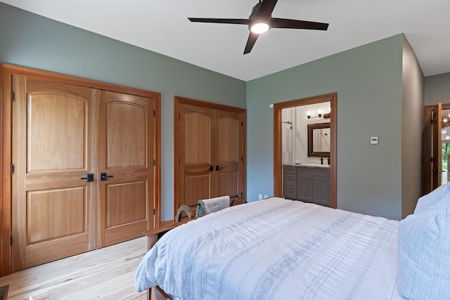 bedroom with ensuite bath and ceiling fan