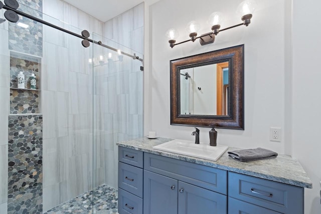 bathroom with vanity and walk in shower