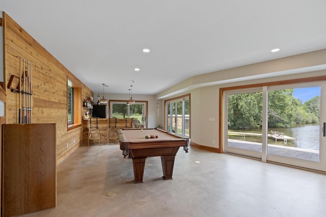 rec room with pool table, concrete flooring, and wooden walls