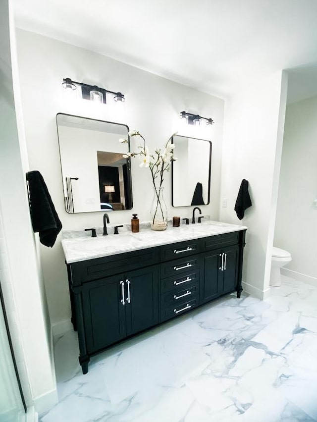 bathroom with vanity and toilet