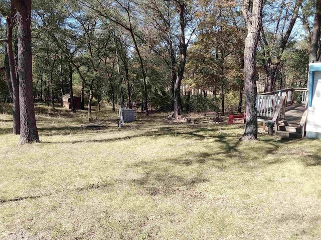 view of yard with a wooden deck