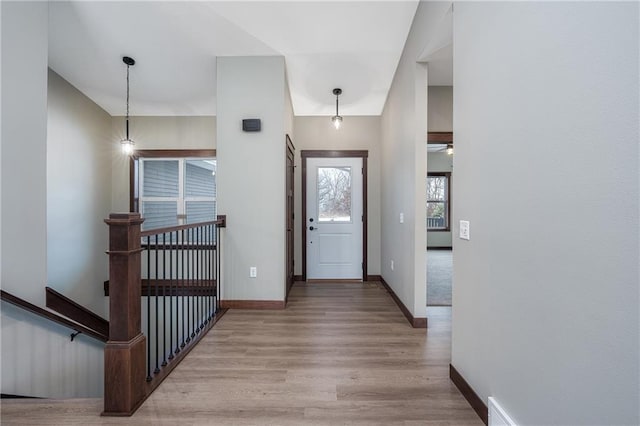 foyer entrance with light wood-type flooring