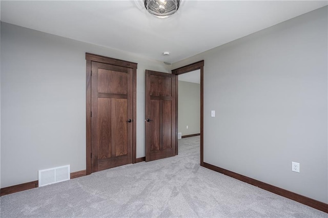 unfurnished bedroom with light carpet