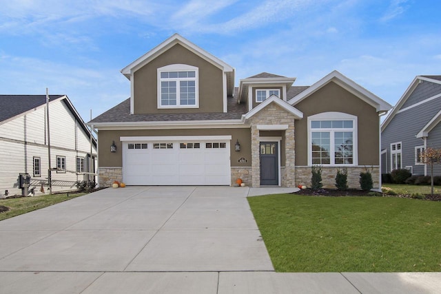 4703 98th St, Pleasant Prairie, WI 53158 - craftsman inspired home with a front lawn, a garage, driveway, stone siding, and stucco siding